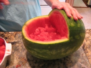 scooping out the watermelon